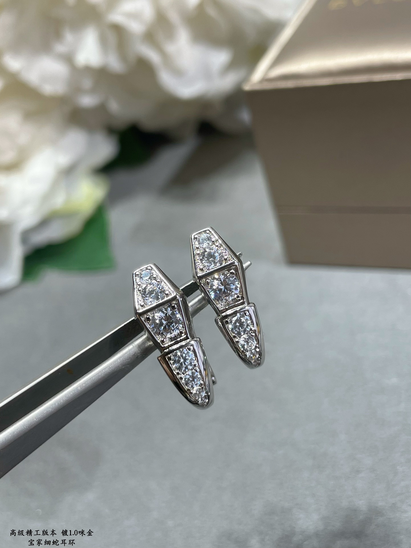 b*l*ai full of Di*m*nd snake earrings